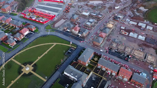 UK building site for housing development. grassy open park areas and muddy site conditions next to each other from the air. 

Drone

4k 25fps 10bit blog-rec709 photo