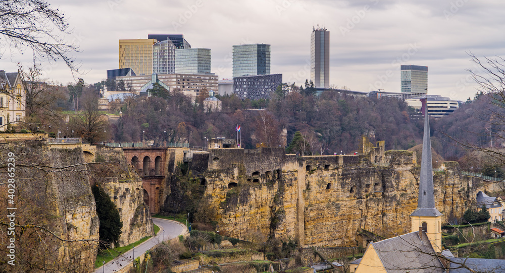 Panoramic view of Luxembourg-City, Luxembourg with Casemates modern highrises in Kirchberg business district in the background on a stormy day