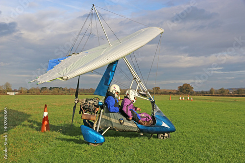 Canvas-taulu Ultralight airplane in a landing field