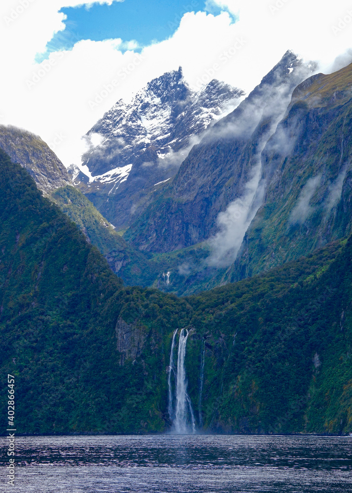 New Zealand, South Island, amazing waterfall and mountains in the Milfort Sound. New Zealand, South Island, amazing waterfall and mountains in the Milfort Sound.