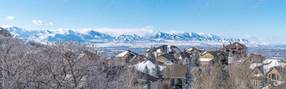 Panoramic view of Alpine Utah with snowy mountains and houses in winter