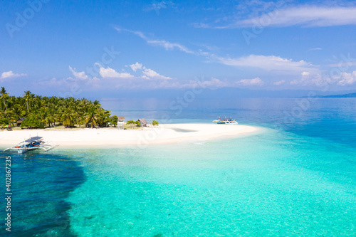 Tranquil beach scenery. Exotic tropical beach landscape with white sand beach and amazing turquoise sea.