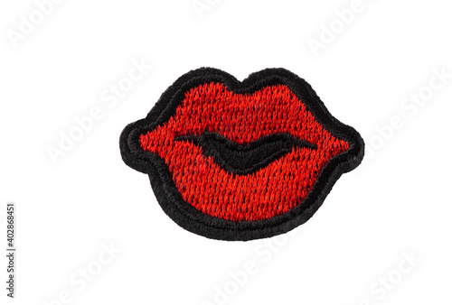 Emobroidered red lips patch isolated on white background photo