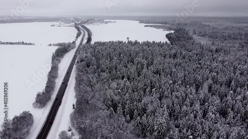 Winter landscape over road out of town