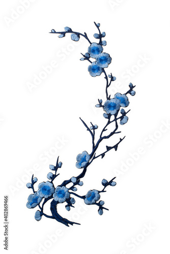Embroidered branch with blue flowers applique isolated on white background