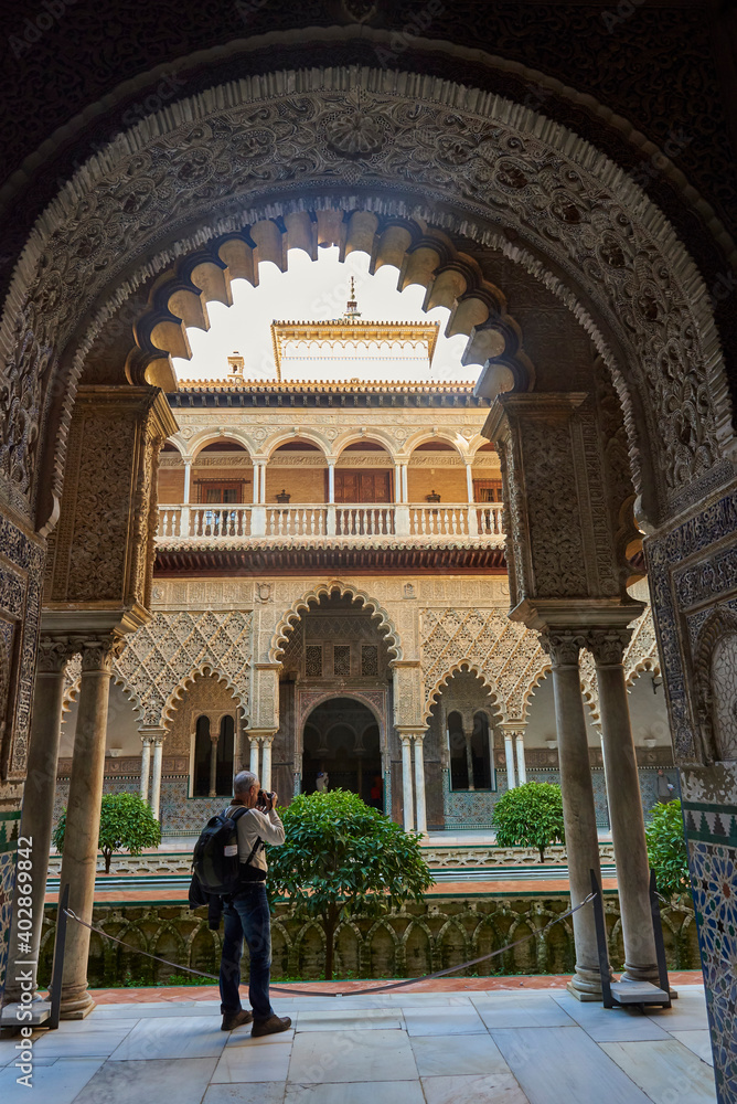 Fototapeta premium View of the Medieval garden and courtyard, the Patio de las Doncellas, of the Royal Palace, Sevilla, Spain, Europe.