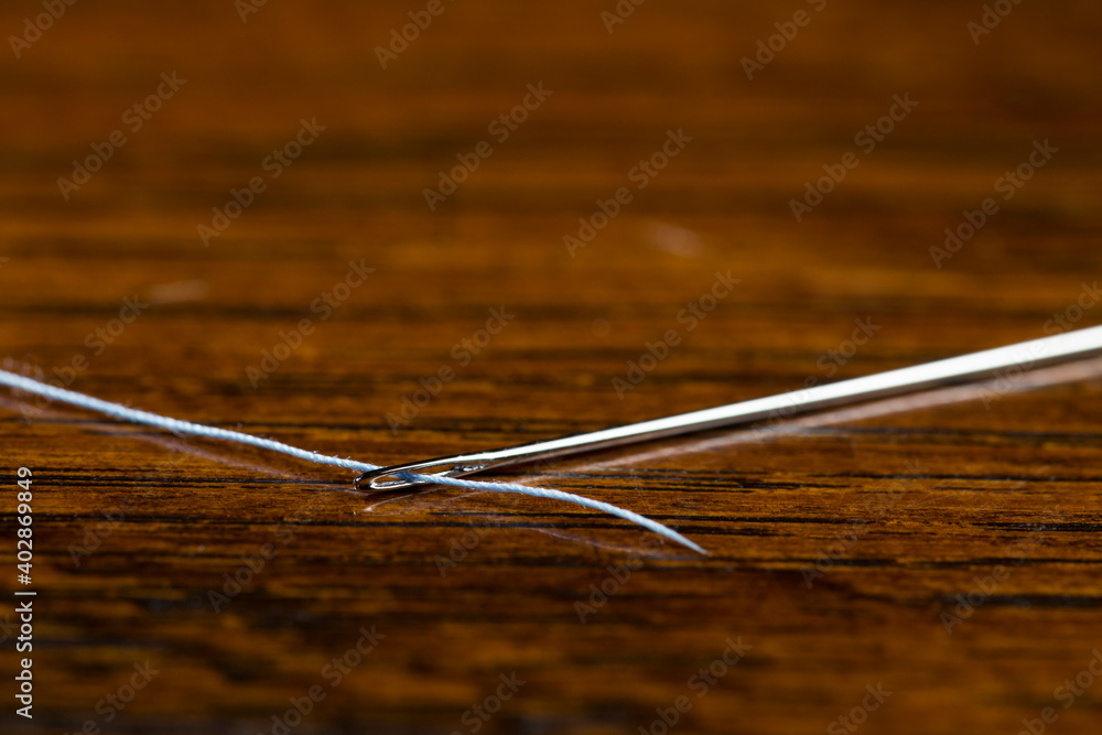 Threading the eye of the needle, sewing Threading the eye of the needle, sewing