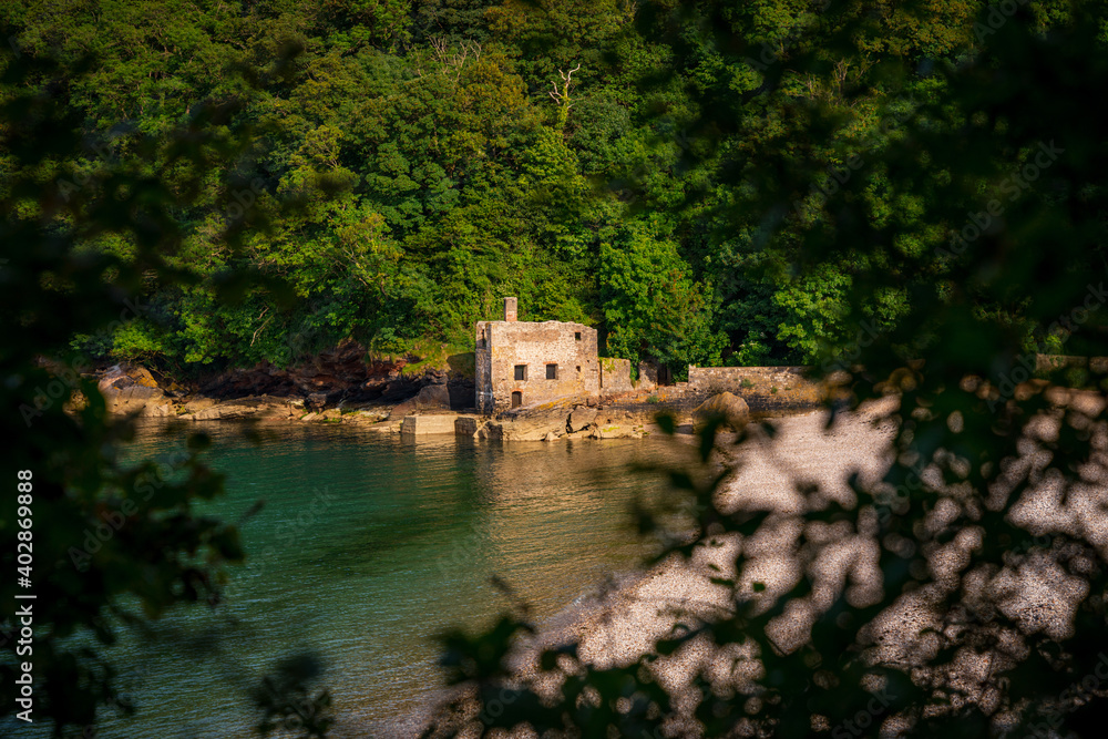 The disused bath-house at Elberry Cove, Torbay, England, UK