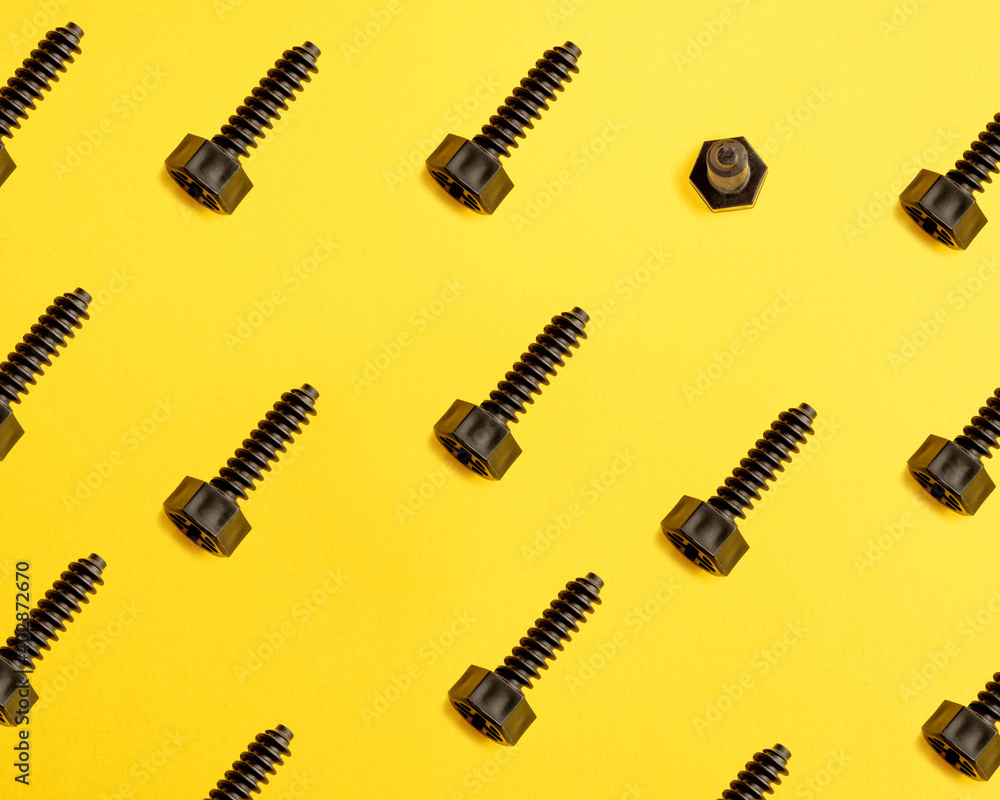 Baby plastic bolts on the yellow background. pattern. Baby plastic bolts on the yellow background. pattern.