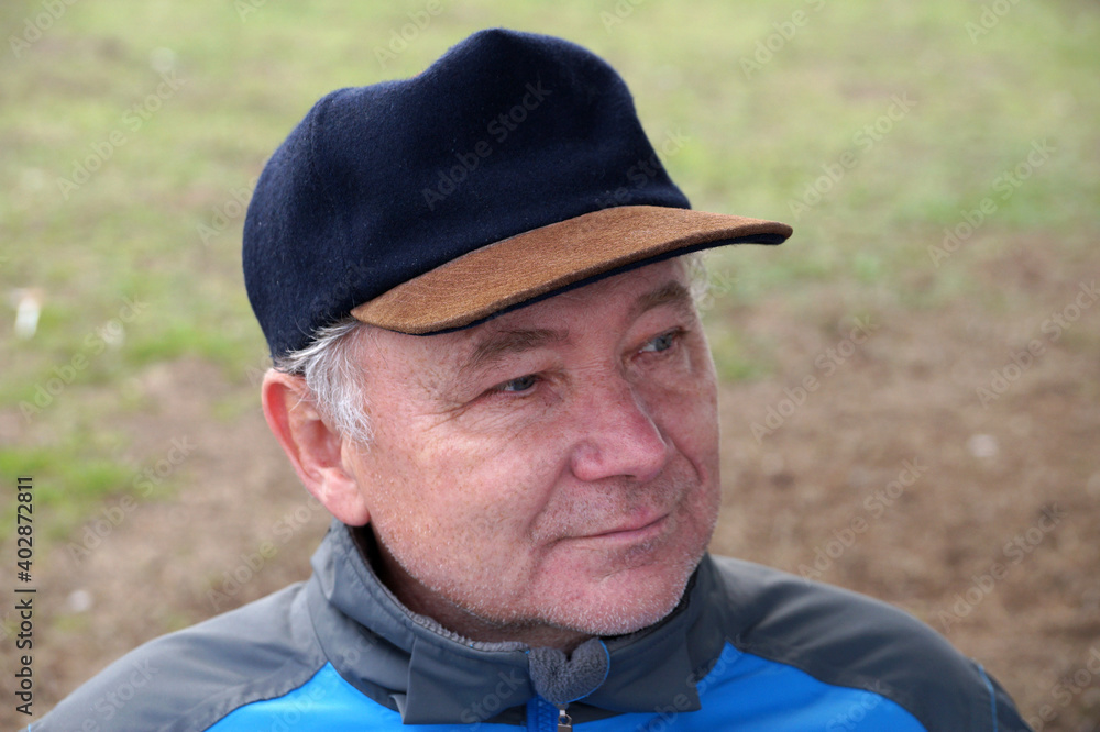 portrait of a smiling middle aged man on a natural background