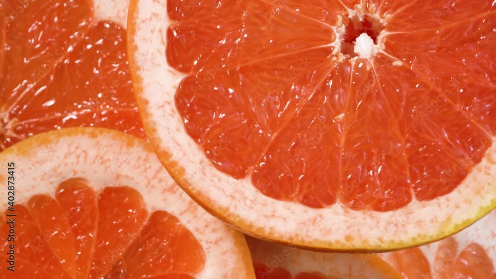 Grapefruit sliced half rotating. Citrus fruits Top view Grapefruit sliced half rotating. Citrus fruits Top view