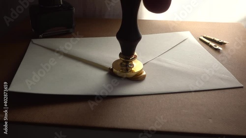 Slow-motion of stamping wax for sealing a secure letter. Concept of secret conversation sends in the past. The 18th-century technique of mailing. Medieval way to send encrypted secured messages.