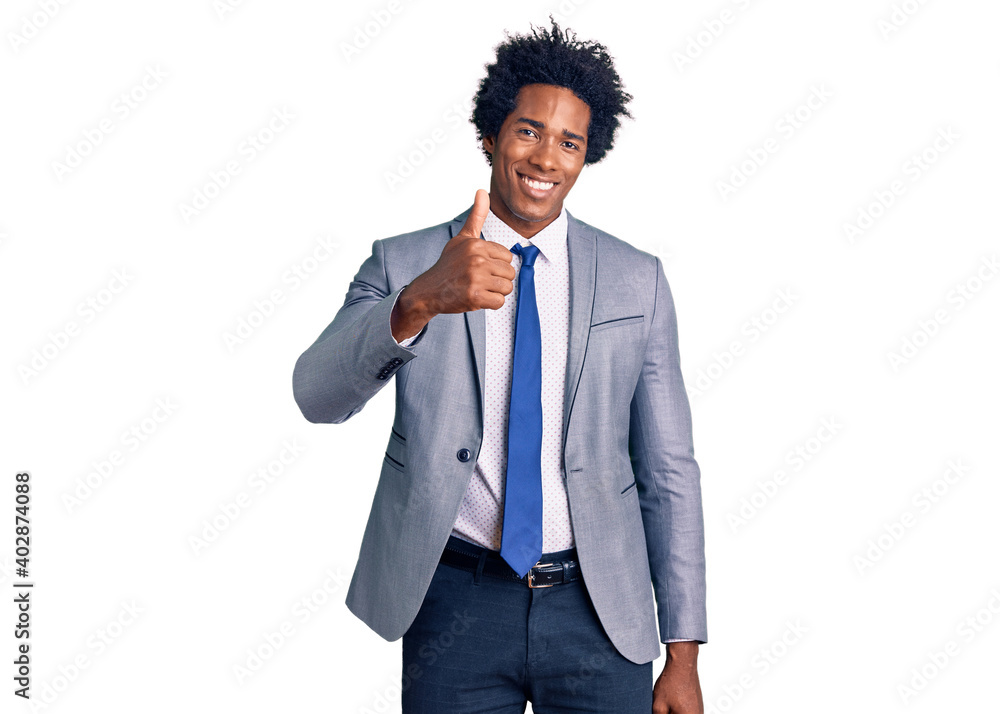 Handsome african american man with afro hair wearing business jacket doing happy thumbs up gesture with hand. approving expression looking at the camera showing success. Handsome african american man with afro hair wearing business jacket doing happy thumbs up gesture with hand. approving expression looking at the camera showing success.