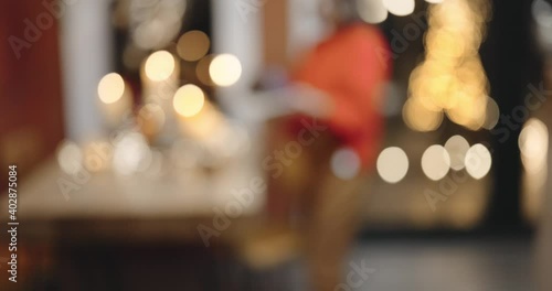 Wallpaper Mural Woman carrying a chocolate pie, preparing for the New Year holidays at home. Transition from blurred image. Festive mood, delicious holiday food, celebrating alone concept Torontodigital.ca