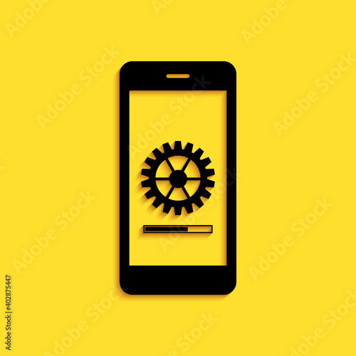 Black Smartphone update process with gearbox progress and loading bar icon isolated on yellow background. System software update and upgrade concept. Long shadow style. Vector.