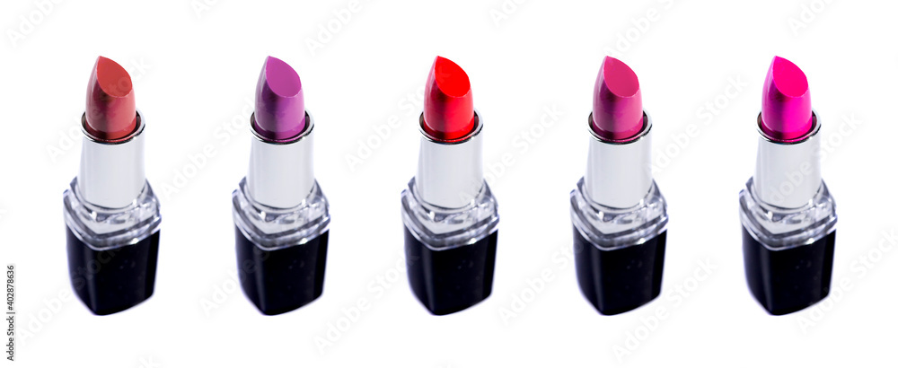 Obraz premium Five Tubes of Different Colored Lipsticks on a White Background
