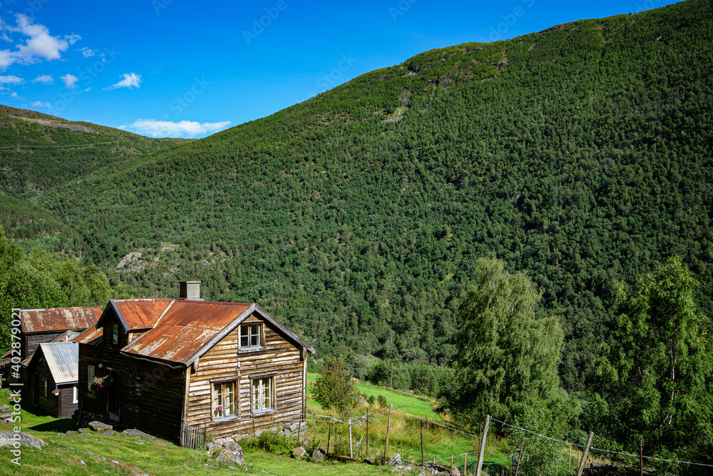 Small cabin in a landscape with mountains in Norway