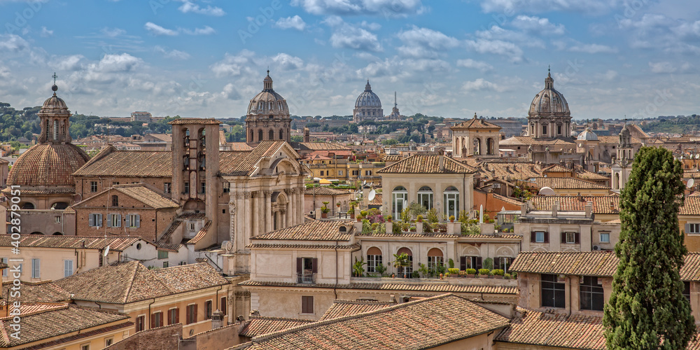 Rooftop view of the city skyline of Rome. City skyline with Saint Peter Basilica in the background in a summer day, Rome, Italy