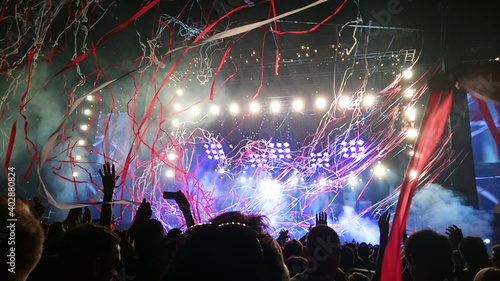 Photos crowd at concert with confetti