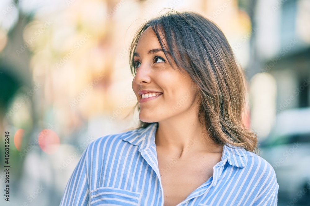 Young hispanic woman smiling happy standing at the city. Young hispanic woman smiling happy standing at the city.