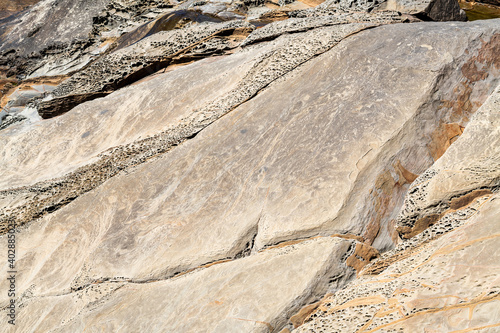 The surface of weathered rock formations on the Pacific coast at Cape Sebastian State Park, Oregon, USA