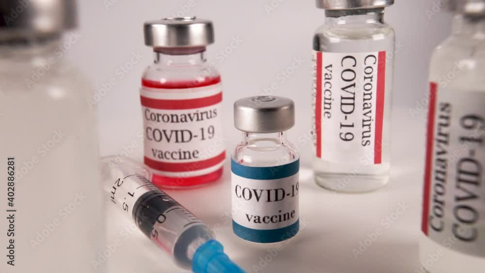 Close-Up Ampoules With Red Medical Vaccine With Syringe Close-Up Ampoules With Red Medical Vaccine With Syringe