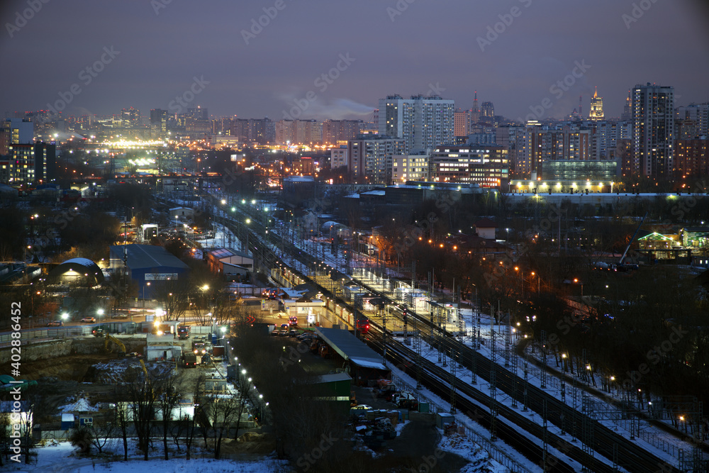 Moscow, Russia. Desember 23 2020: Trains and the Moscow skyline. Ostankino railway platform.