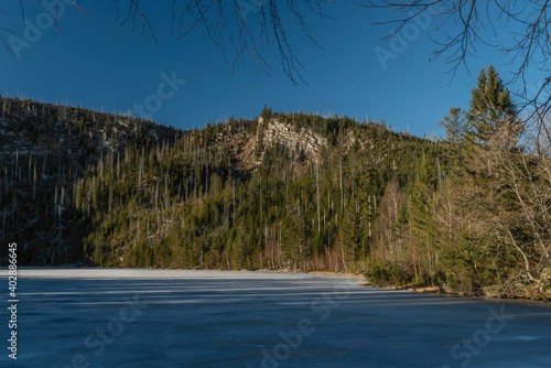 Plesne lake with ice and snow in winter beautiful sunny fresh day photo