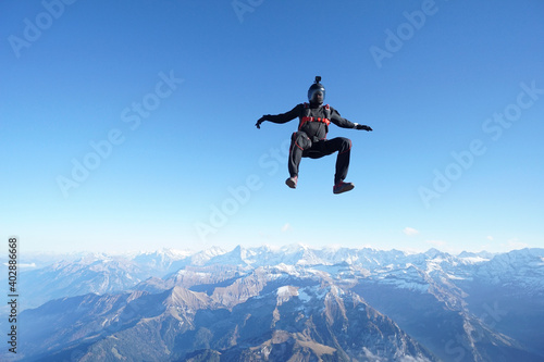 Skydiver with camera mount freefalls through air