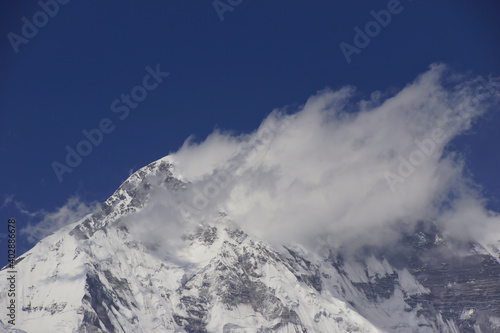 Summit of Mount Everest covered in clouds. Photographed from Gokyo Ri. One of the best view points on Everest. 