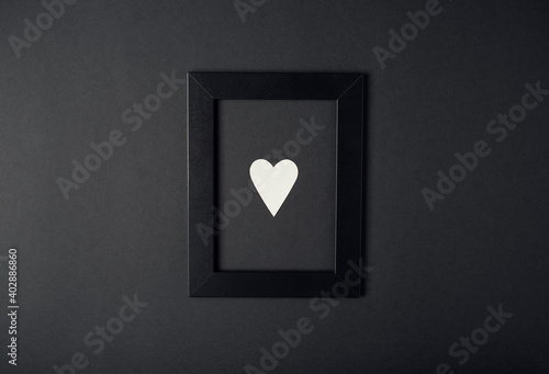 Hearts composition. Photo frame and white heart on red background. Valentines day concept. Flat lay, top view