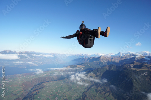 Skydiver with camera mount freefalls through air