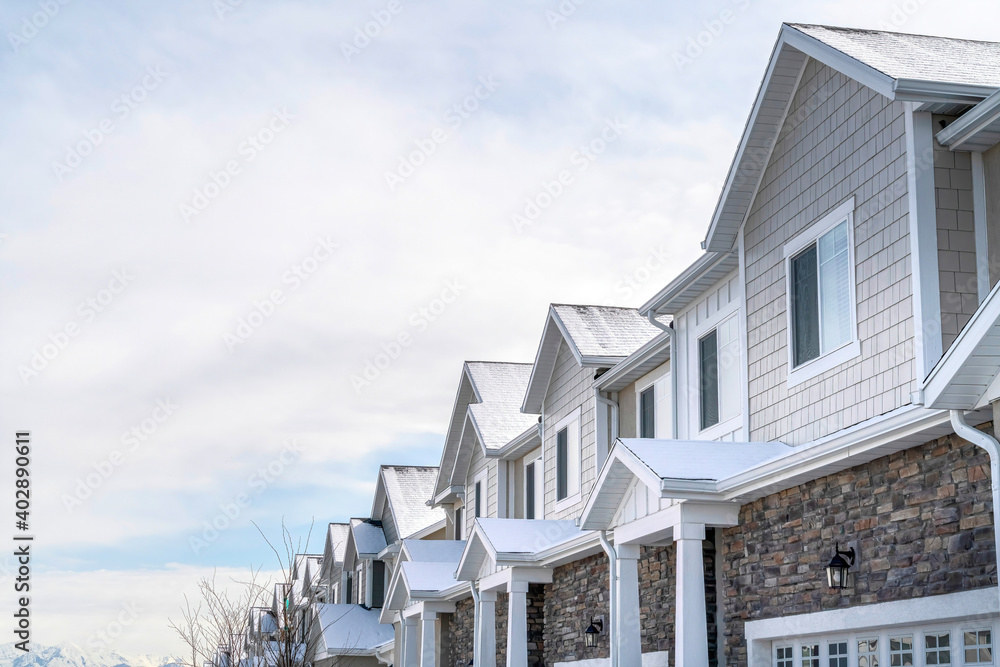 Row of houses in the scenic suburbs community with overcast sky background