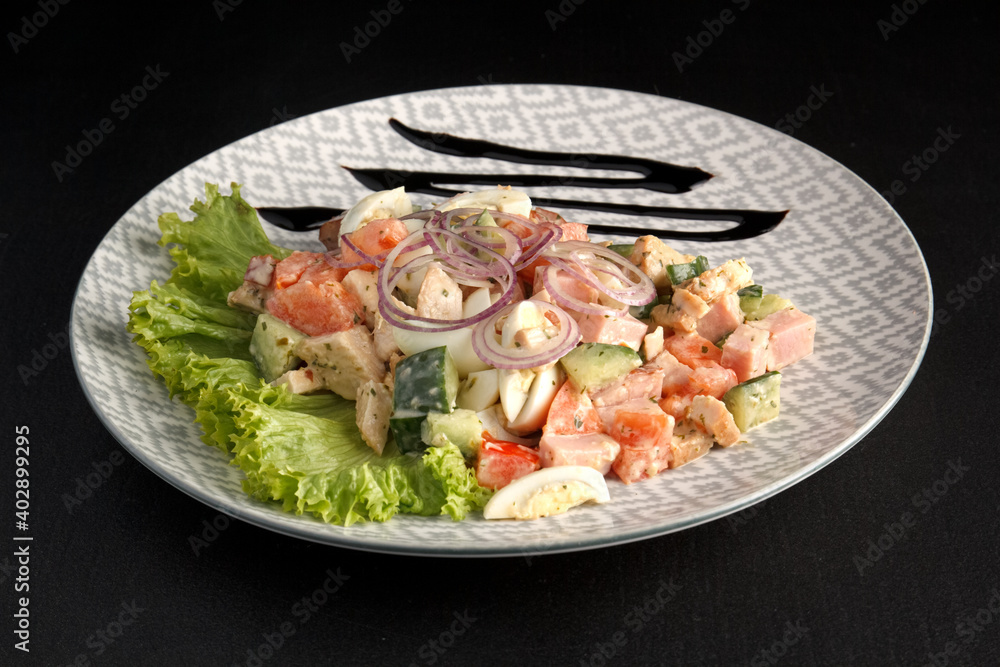 Delicious and healthy salad on a dark background Delicious and healthy salad on a dark background