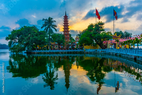 HANOI, VIETNAM, 4 JANUARY 2020: Beautiful sunset over the Tran Quoc Pagoda of Hanoi