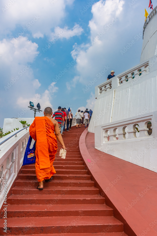 BANGKOK, THAILAND, 12 JANUARY 2020: Monk ascending the Golden Mount