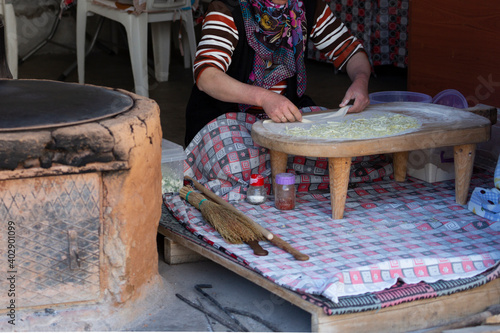 A peasant woman who makes gozleme with cheddar cheese
