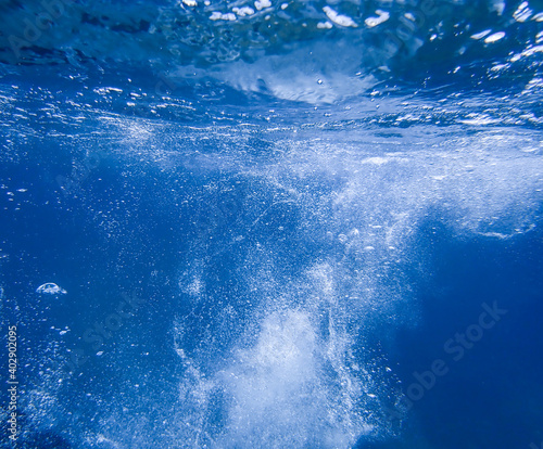 Air bubbles underwater rising to water surface, natural scene, Mediterranean sea, Rising Bubbles in Deep Underwater, Underwater with bubbles. Great for backgrounds.