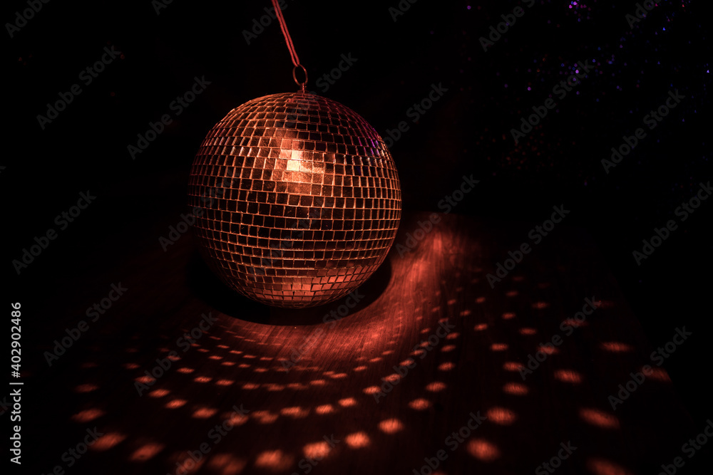 Obraz premium Colorful disco mirror ball lights night club background. Party lights disco ball. Selective focus