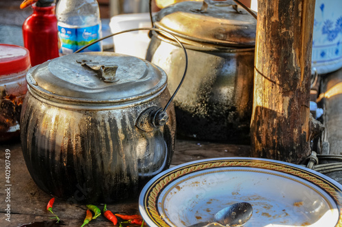 Blackened pots in a kitchen of a street restaurant in Vietnam.