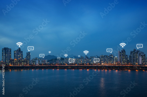Photography Lit residential district and bridge along the Han River in Seoul, South Korea, at night