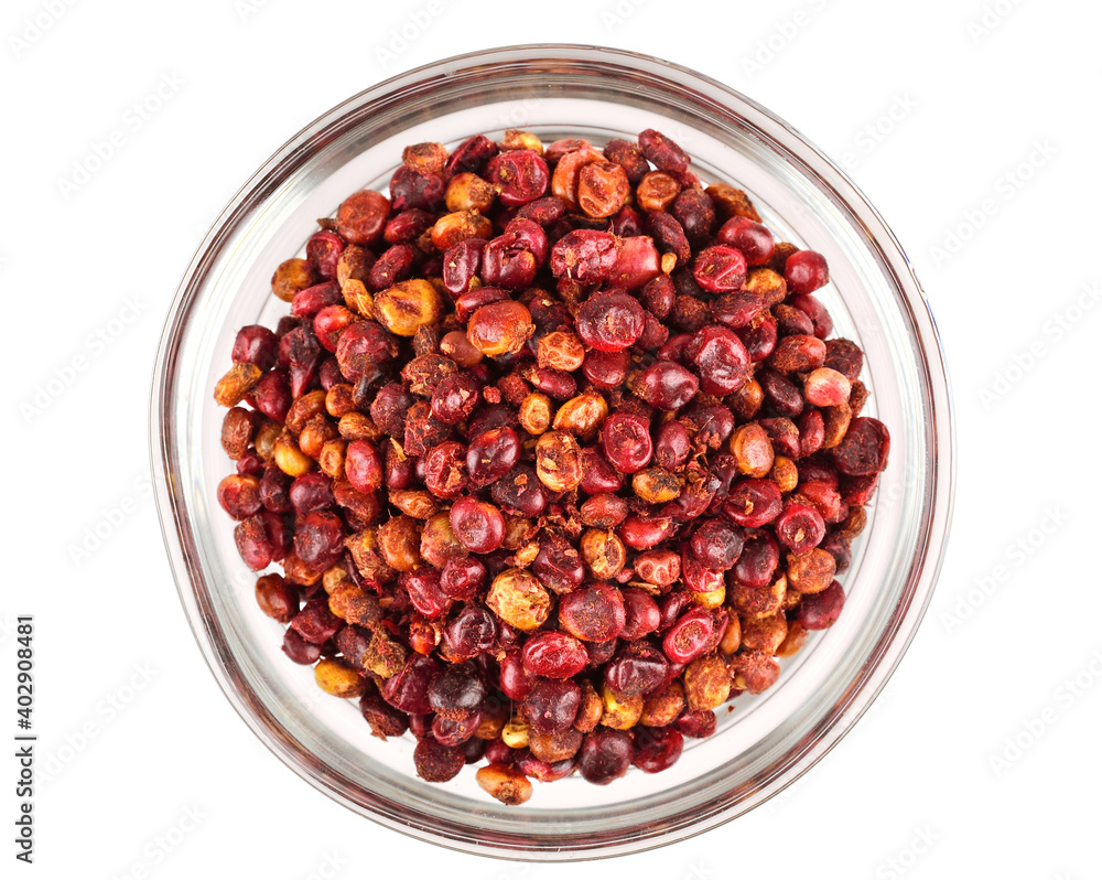 Whole Dry Sumac (Rhus) Berry Seed in a Glass Bowl. Top View. Isolated on White Background. Whole Dry Sumac (Rhus) Berry Seed in a Glass Bowl. Top View. Isolated on White Background.