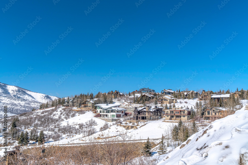 Scenic panorama of mountain homes on a winter setting in Park City community