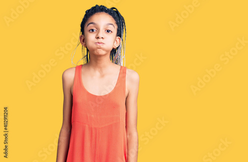 Slika na platnu Cute african american girl wearing casual clothes puffing cheeks with funny face
