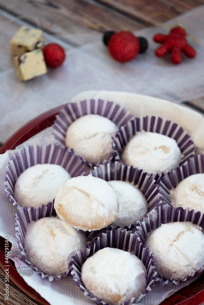 Greek Christmas cookies kourabiedes with almonds powered with white sugar Greek Christmas cookies kourabiedes with almonds powered with white sugar