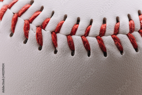 A baseball used to play baseball - consists of a rubber or cork core wrapped in yarn - The ball is covered with white leather on top with red threads