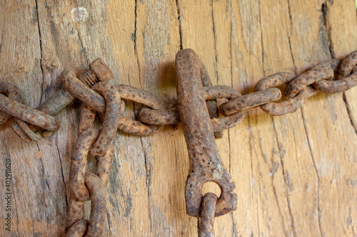 Old, rusted, corroded chain used on a farm