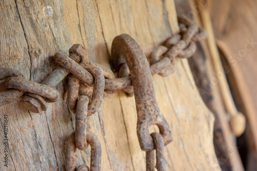 Old, rusted, corroded chain used on a farm