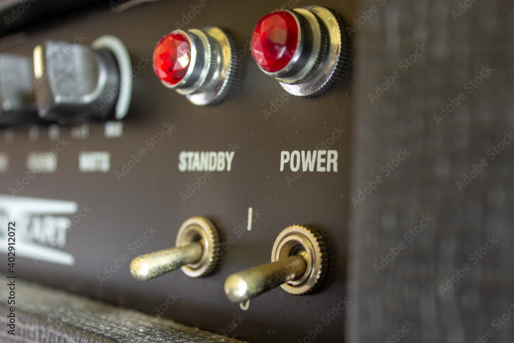 Buttons, knobs and lights of a guitar amplifier Buttons, knobs and lights of a guitar amplifier