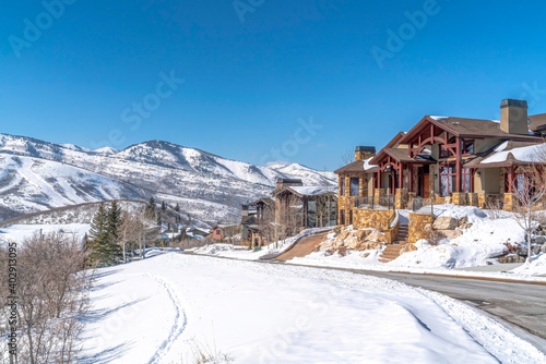 Residential community in Park City with homes and mountain view against blue sky